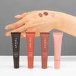 Anfisa An-Gloss product shot showing all 4 tubes and products on skin