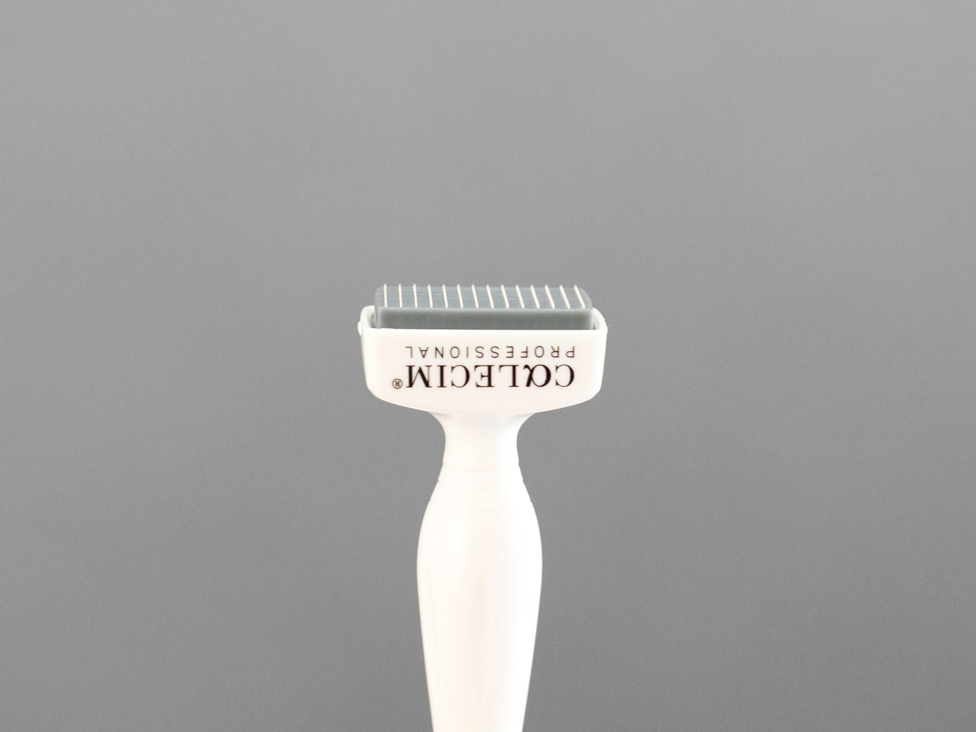 Closeup of the dermastamp included with the Calecim Advanced Hair System