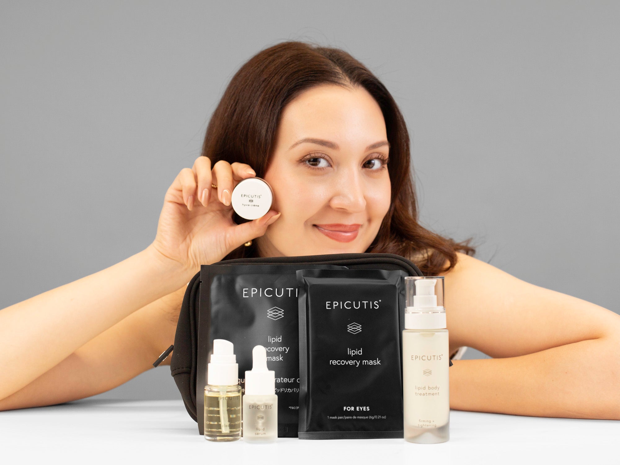 Laziza from LAZ Skincare showing the contents of the Epicutis Luxury Travel set
