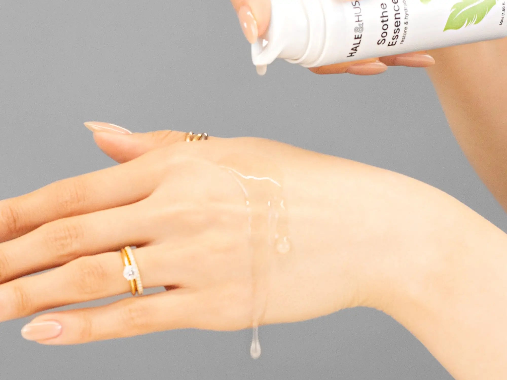 Laziza from LAZ Skincare demonstrating the texture and application of Hale & Hush Soothe Essence Serum on her hand