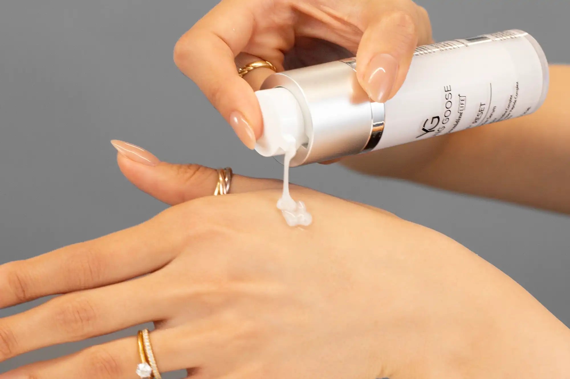 Laziza from LAZ Skincare demonstrating the texture and application of Young Goose Youth Reset on her hand