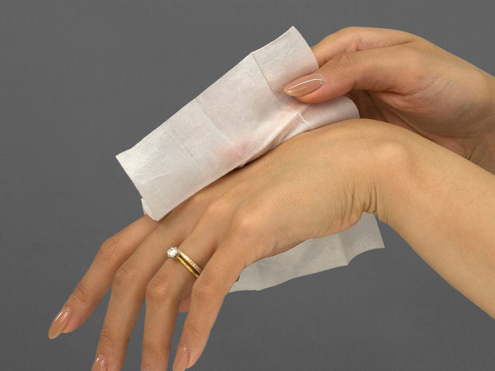 Laziza from LAZ Skincare demonstrating the texture and application of iS Clinical Active Peel System on her hand