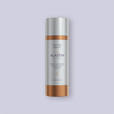 Alastin C-Radical Defense Antioxidant Serum bottle on a light purple background