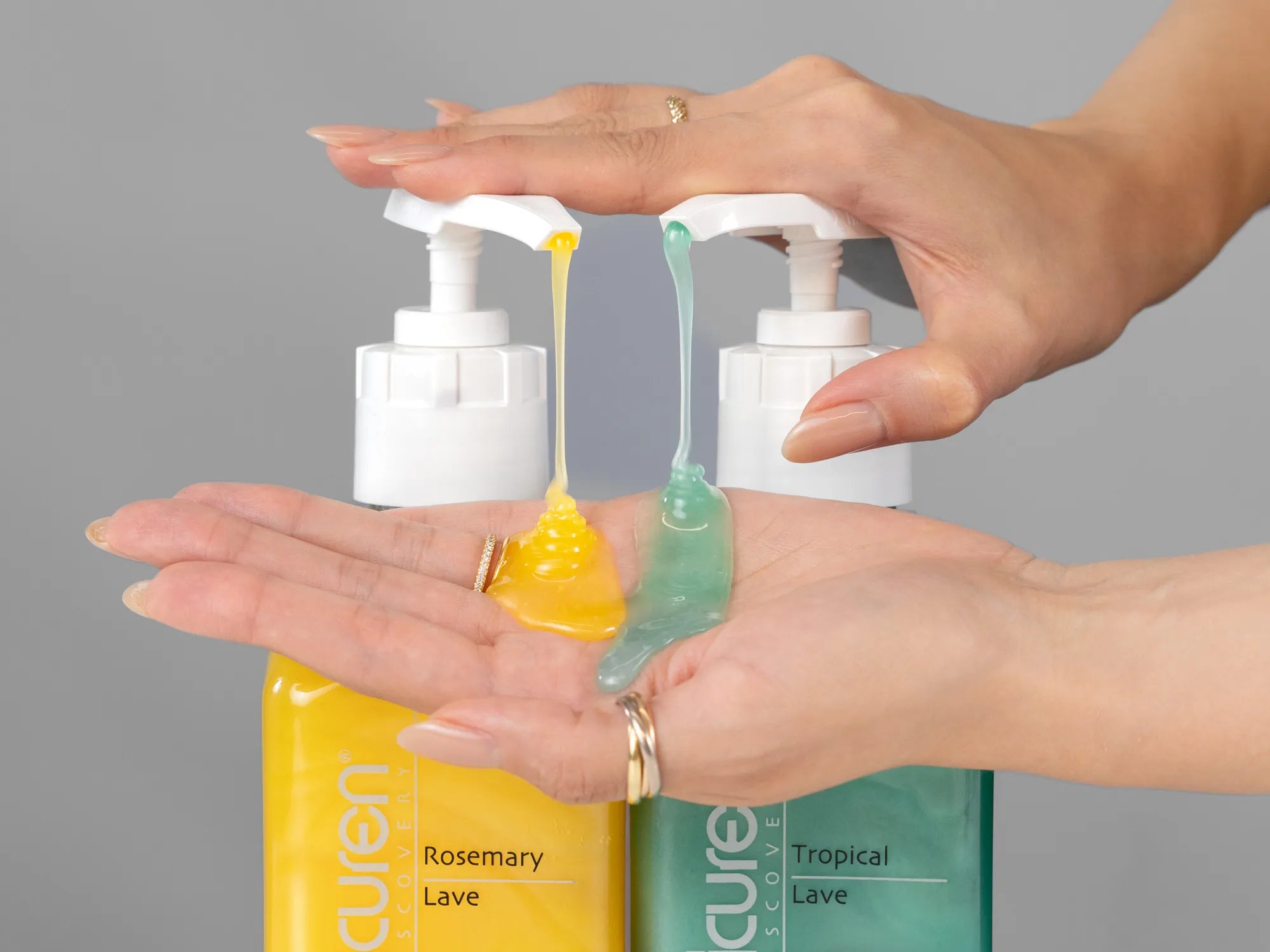 Closeup of Laziza from LAZ Skincare holding up a bottle of Epicuren Lave Body Cleanser