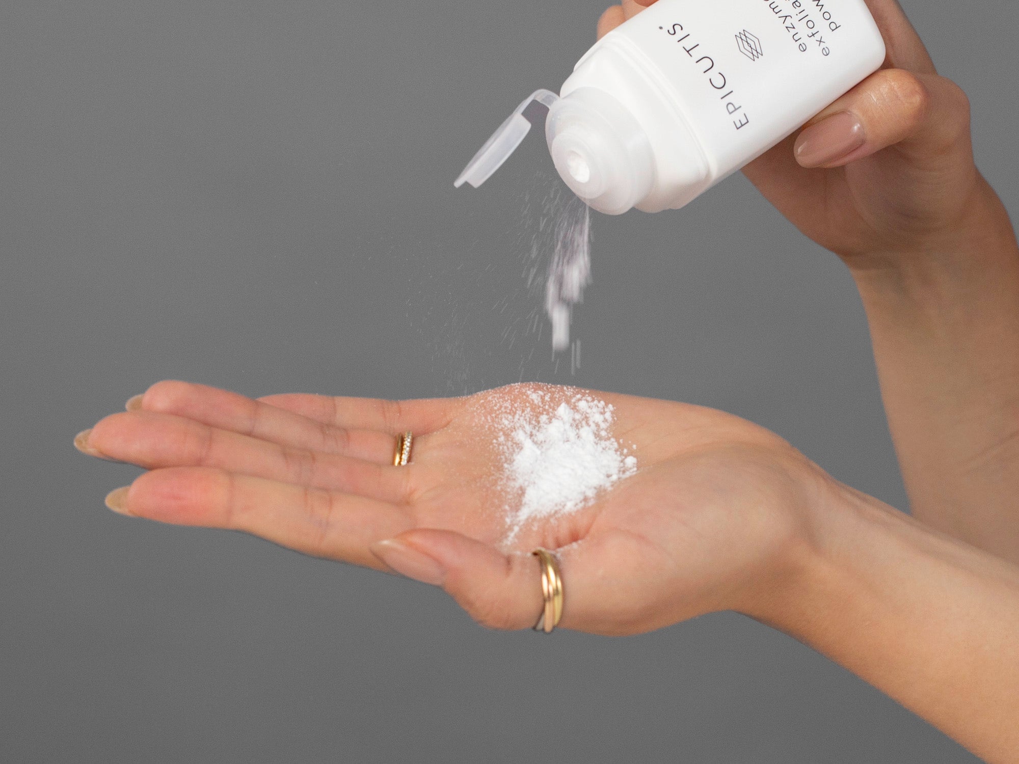 Closeup of Laziza from LAZ Skincare applying enzyme exfoliating powder from the Epicutis Cleansing Essentials Set