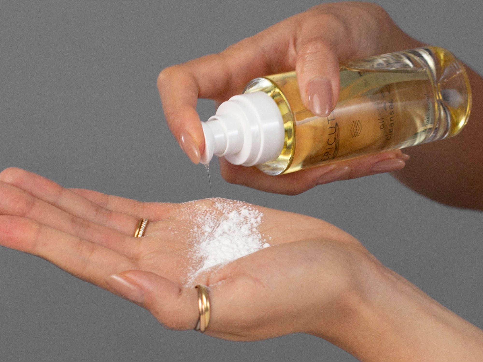 Closeup of Laziza from LAZ Skincare applying oil to enzyme powder from the Epicutis Cleansing Essentials Set