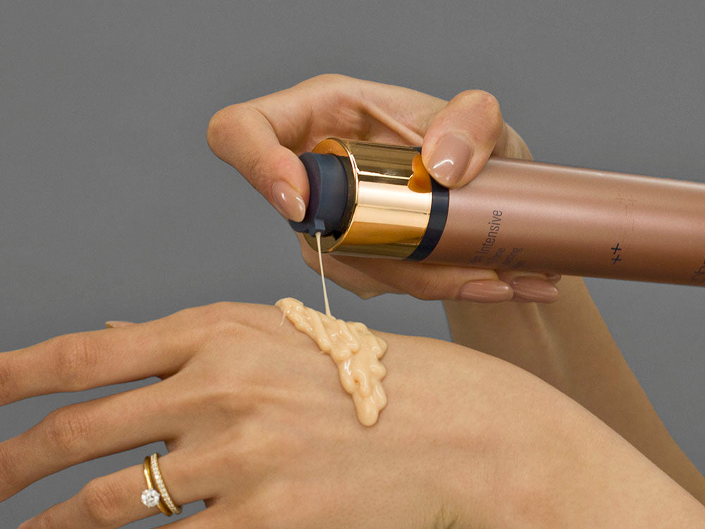 Laziza from LAZ Skincare demonstrating the texture and application of SkinBetter Science Even Tone Correcting Serum on her hand