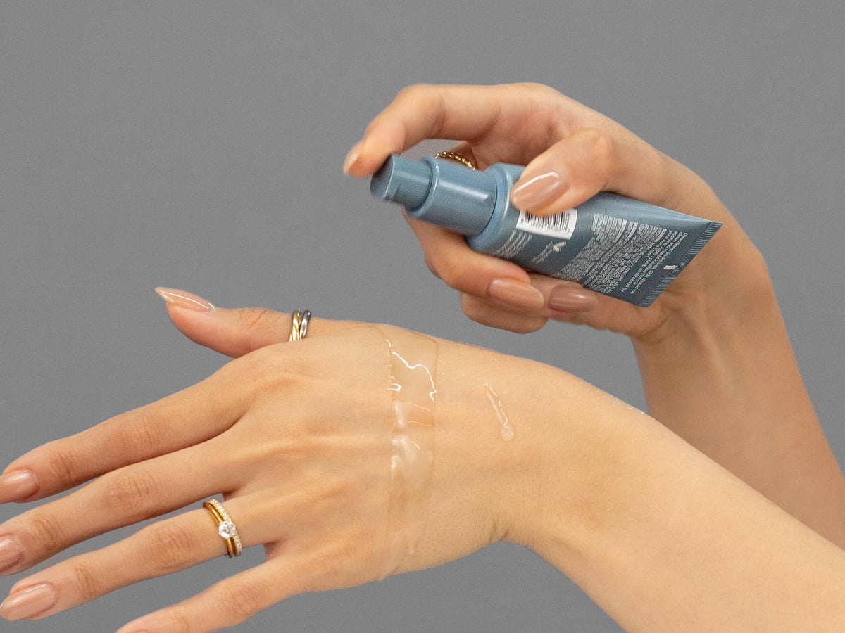 Laziza from LAZ Skincare demonstrating the texture and application of Face Reality Mandelic Serum on her hand