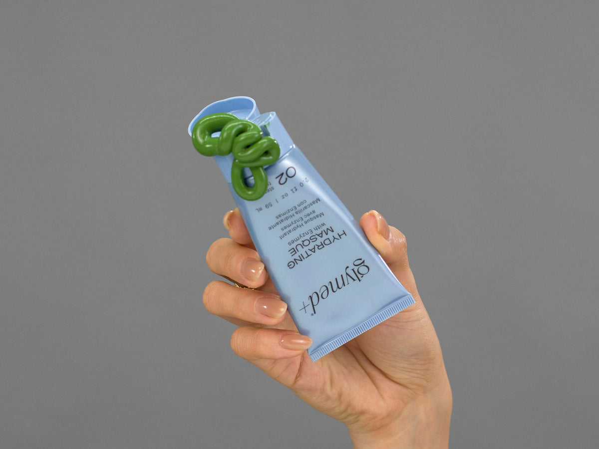 Closeup of Laziza from LAZ Skincare holding up a bottle of GlyMed Hydrating Masque