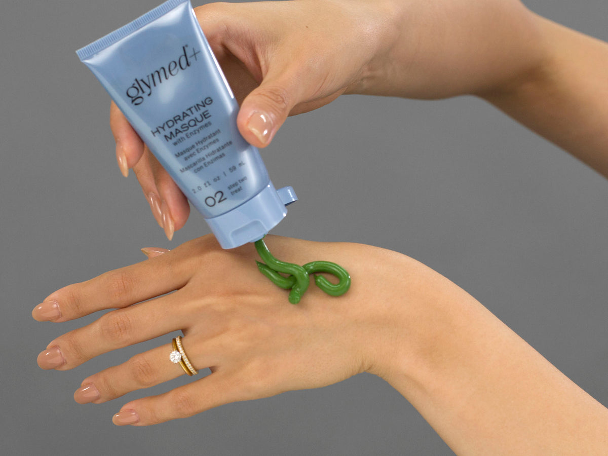 Laziza from LAZ Skincare demonstrating the texture and application of GlyMed Hydrating Masque on her hand