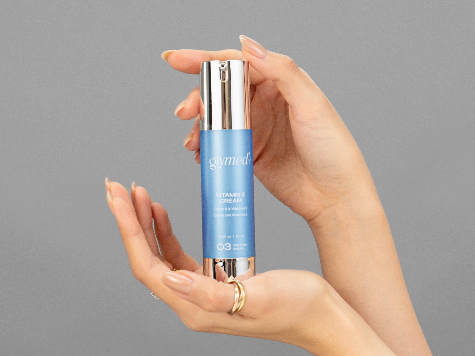 Closeup of Laziza from LAZ Skincare holding up a bottle of GlyMed Vitamin E Cream