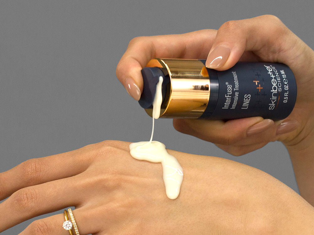 Laziza from LAZ Skincare demonstrating the texture and application of SkinBetter Science InterFuse Intensive Treatment LINES on her hand