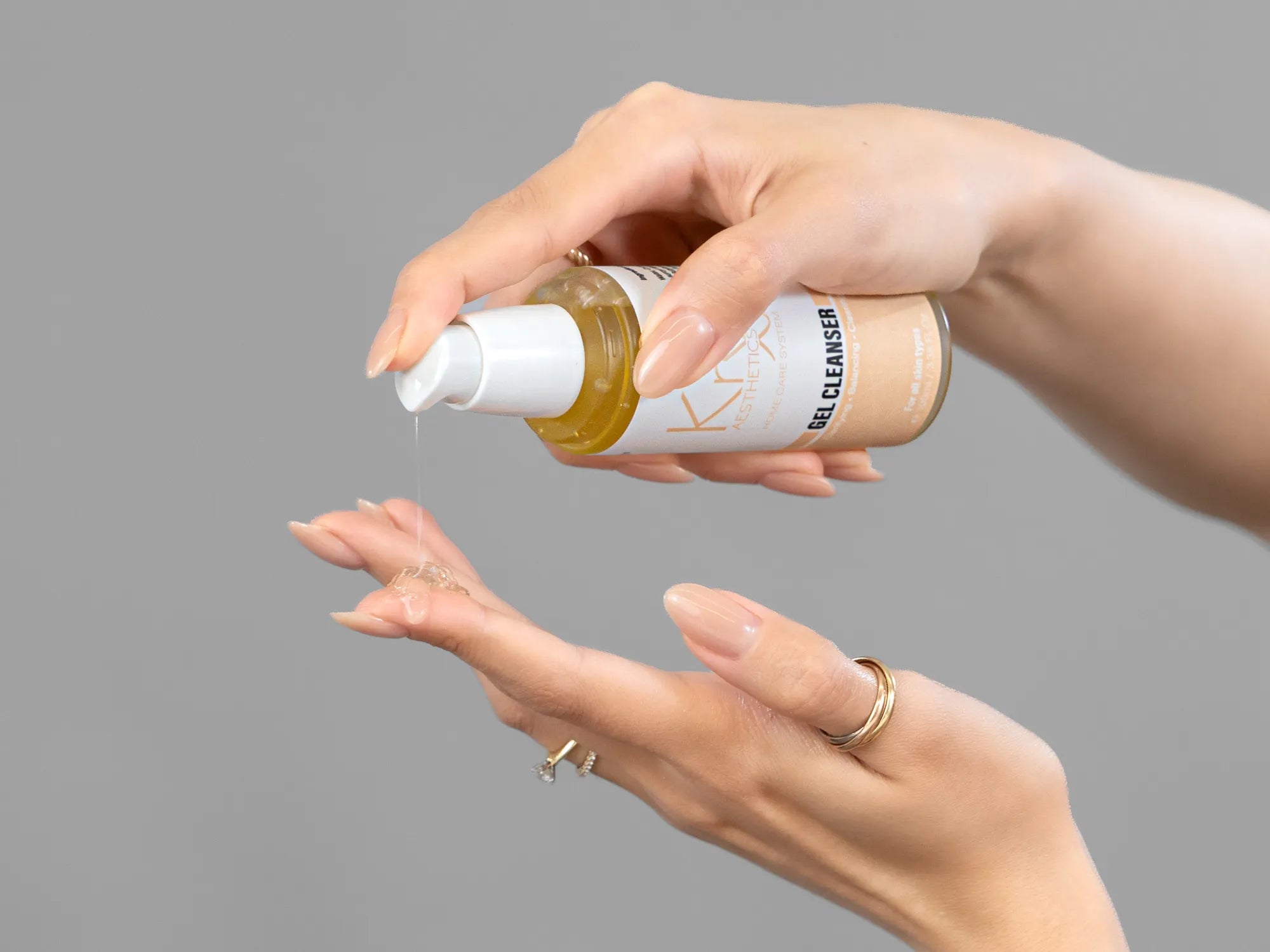 Laziza from LAZ Skincare demonstrating the texture and application of KrX Aesthetics Glow Gel Cleanser on her hand