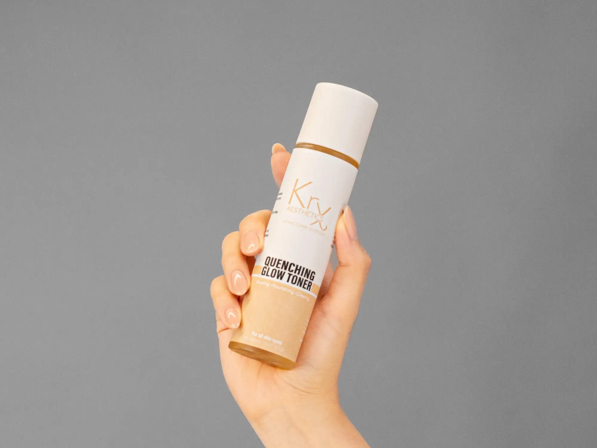 Closeup of Laziza from LAZ Skincare holding up a bottle of KrX Aesthetics Quenching Glow Toner