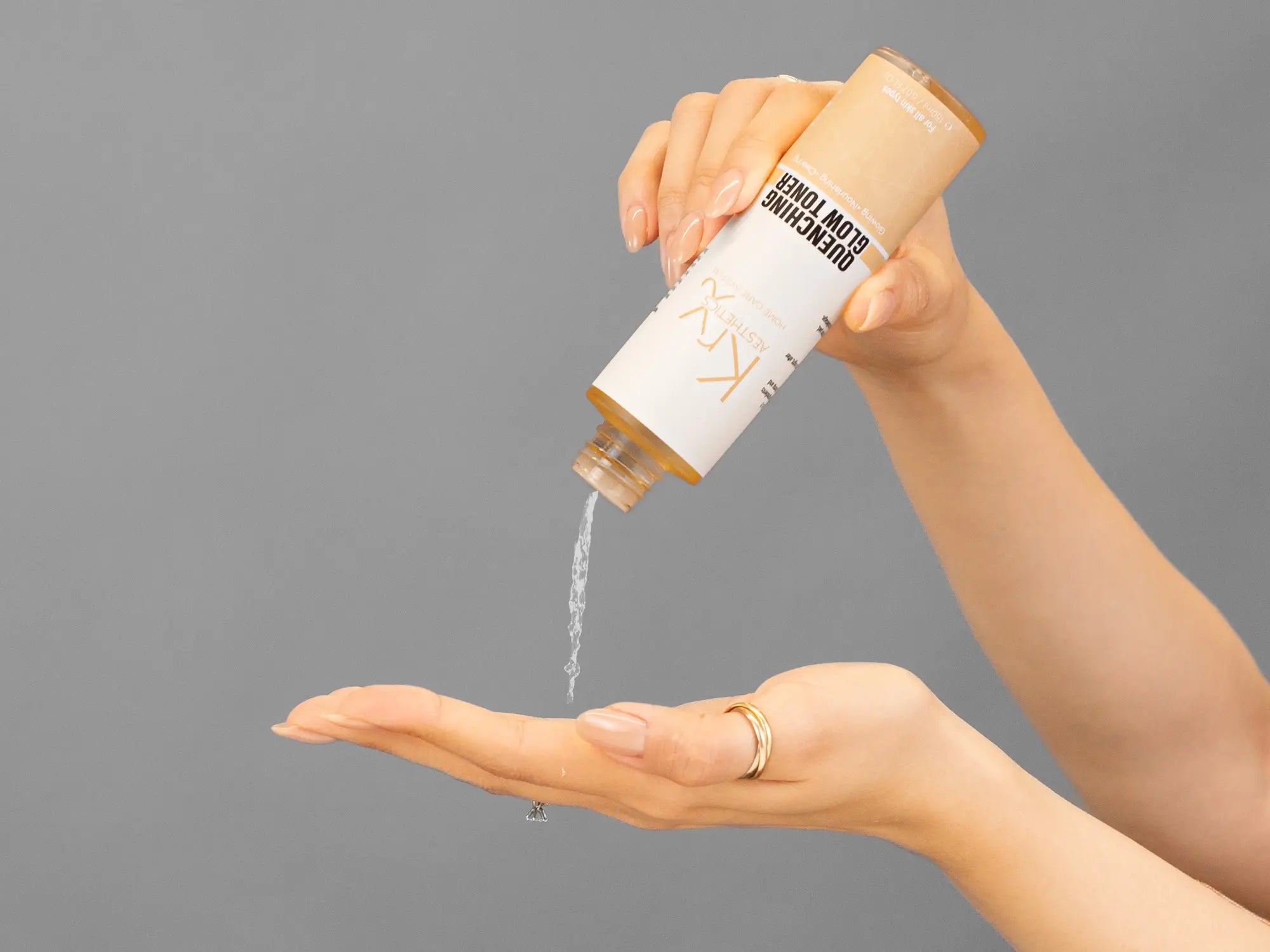 Laziza from LAZ Skincare demonstrating the texture and application of KrX Aesthetics Quenching Glow Toner on her hand