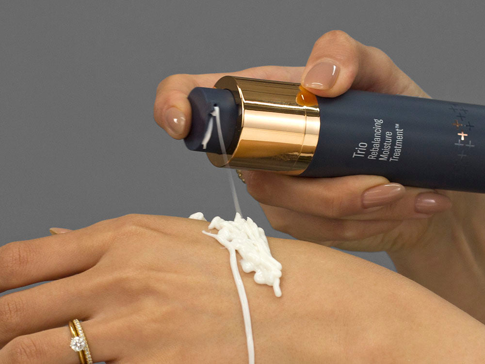 Laziza from LAZ Skincare demonstrating the texture and application of SkinBetter Science Trio Rebalancing Moisture Treatment on her hand