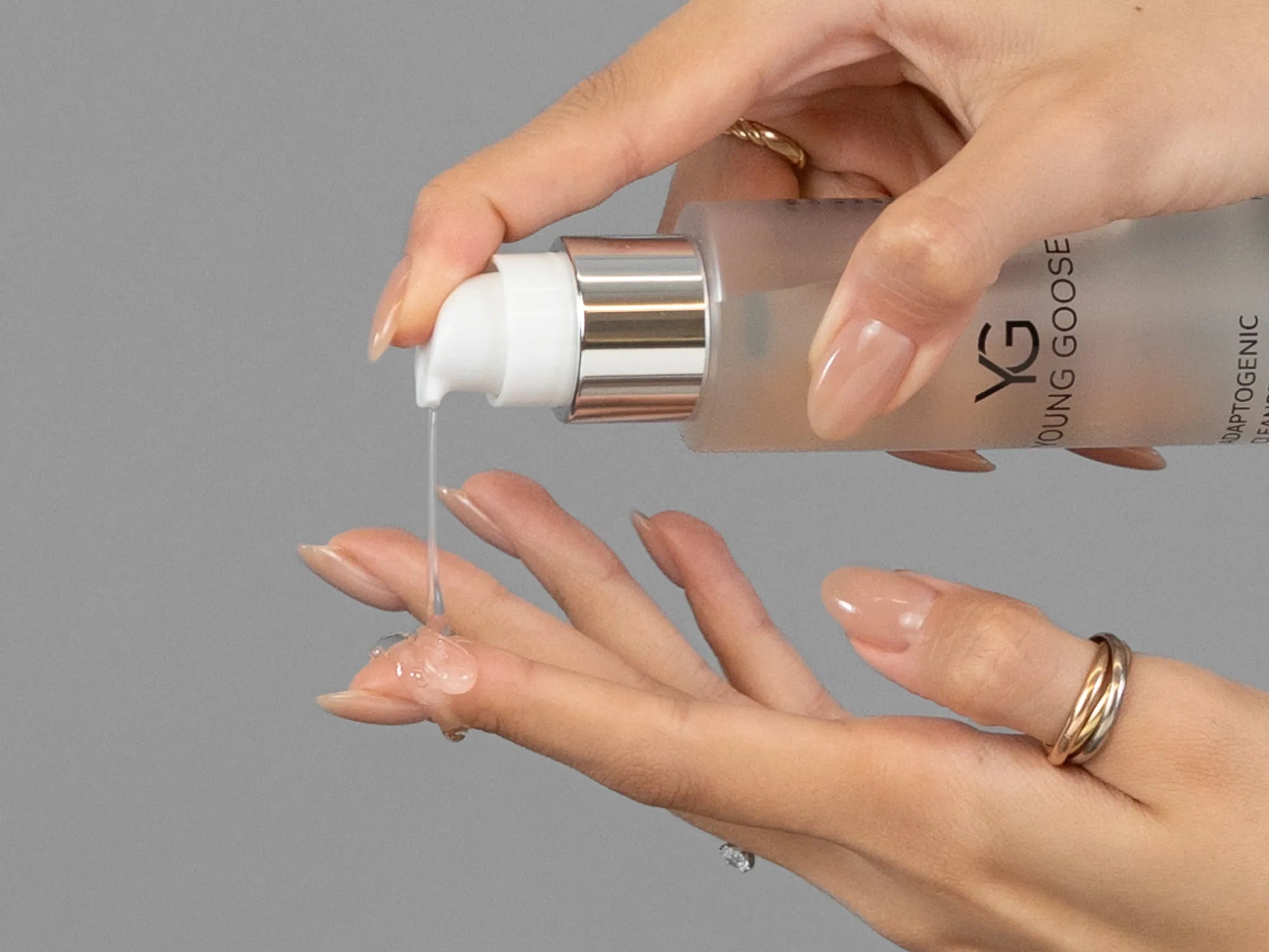 Laziza from LAZ Skincare demonstrating the texture and application of Young Goose Adaptogenic Cleanser on her hand